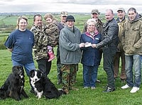 Shooting club’s £2,000  cheque for Hospiscare