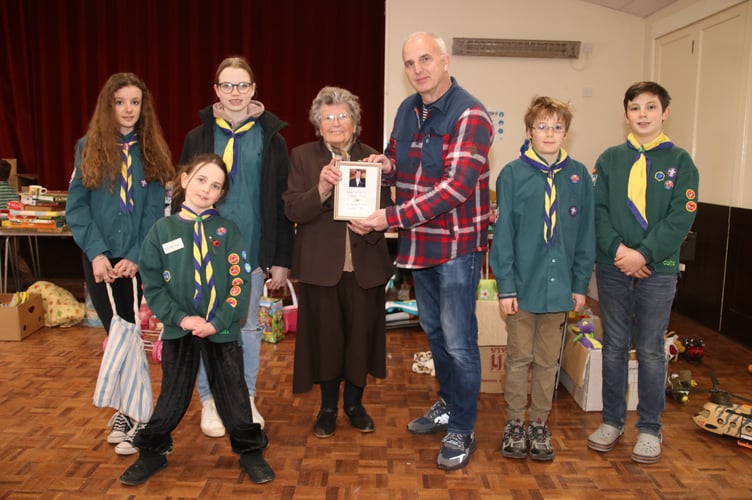 Margaret Phillips presenting Steve Haley, Sandford Scouts Chairman, with her First Sandford Scout Secretary Badge, from 1955.  AQ 5765
