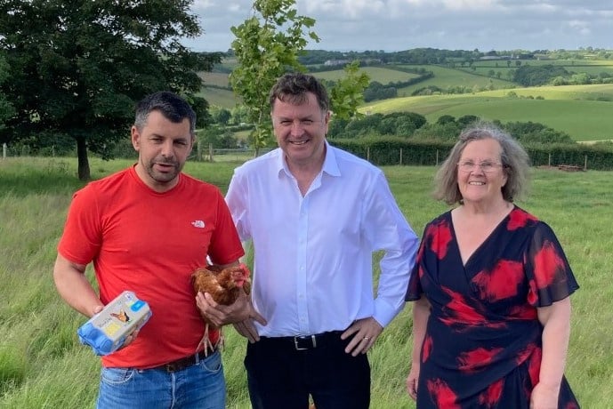 Phil Ayre welcoming Mel Stride MP and Cllr Margaret Squires to Black Dog Eggs at Cobscombe Farm near Washford Pyne.
