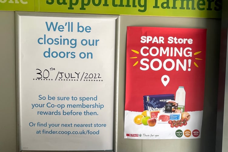 The posters notifying customers of the change of the Crediton High Street Co-op to a Spar at the entrance to the store.  AQ 1366
