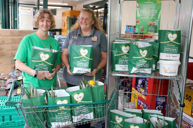 Fiona Cochran, left and Mandy Fosbrooke, received a large amount of food donations for Crediton Food Bank at Crediton Morrisons store on Monday, August 22.  AQ 8463
