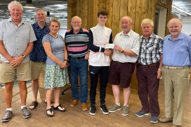 Finley, fifth left, receiving the Crediton Freemasons cheque from Worshipful Brother Colin Wroth with, from left, Brother Lanyon, Finley’s father and mother, Worshipful Brother John Musty and seventh left, Brother Alan Tonkin and right, Brother Bassett.  AQ 3429
