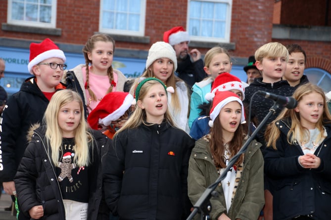 Children singing at last year’s Christmas in Crediton celebrations and Lights Switch-On.
