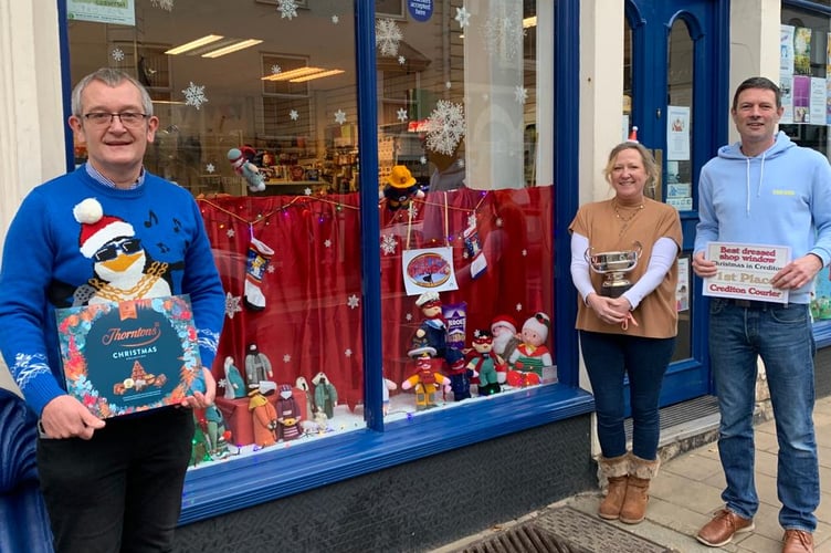 Evans Newsagents was the winner last year, pictured receiving the Rosebowl last year with left, Alan Quick, Editor, Crediton Courier.
