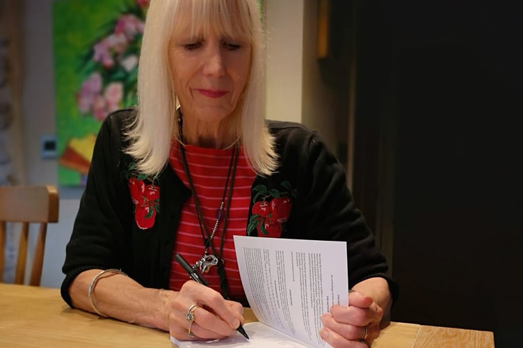 Beverley Byrne signing copies of her anthology of short stories ‘The Dog Gets It!’.
