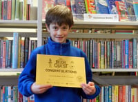 Frank receives certificate for reading 100 books