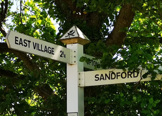 Sandford finger post with a new parking sign.
