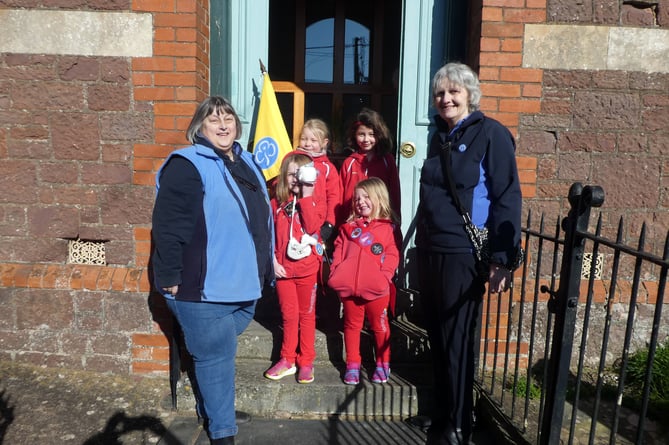 The Rainbows entering the Church with the two Tawny Owls, Linda Tonkin and Linda Rolle.  Photo: David Nunn
