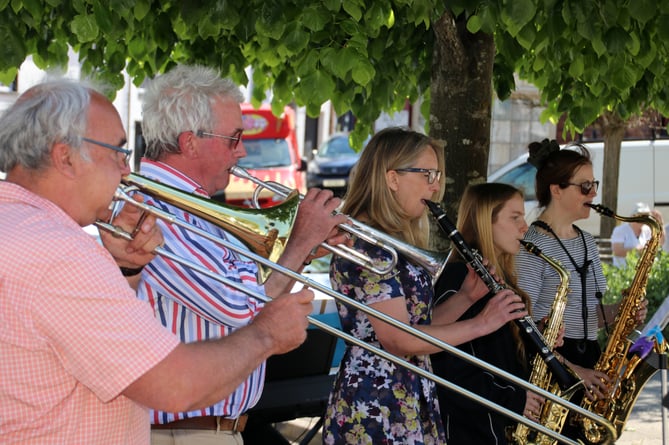 Some of the members of Ady Nuthall’s ‘Holly Water Stompers’ Dixieland Jazz Band during their performance in Crediton’s Town Square on May 30.  AQ 1272