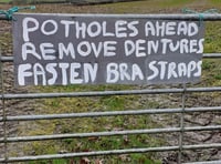 Potholes at Stockleigh English prompt new sign
