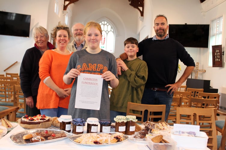 Erin at the cake stall with her family, her brother Elan, father Chris Underhill, grandfather and grandmother George and Jan Underhill and her mum, Nora Jones.  SR 7251