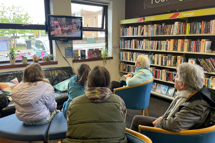 Some of those who watched the Coronation on the screen in Crediton Library.  AQ 7633