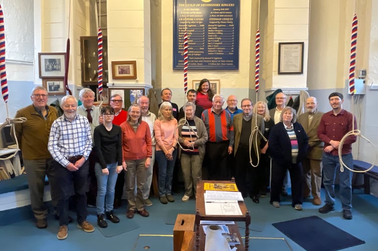 The ringers who rang for the King and centre, Crediton Rector, Rev Matthew Tregenza.  AQ 7591