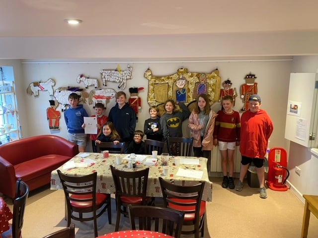 Wording and photographs from the hot chocolate and cake evening held at the ARK, where some Lapford Youth Club members enjoyed being with their Coronation artwork.