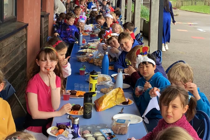 Enjoying the celebration tea at Cheriton Fitzpaine Primary School.