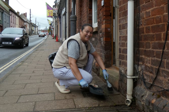 A local resident helping out during the High Street Sweep.