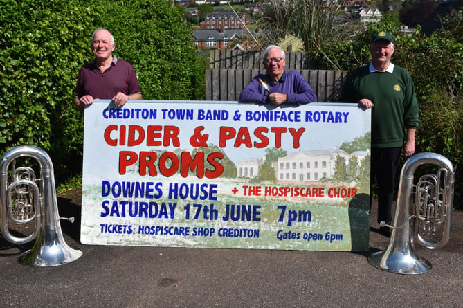 A sign to advertise the Cider and Pasty Proms which has been painted by Mike Palmer, centre, has been produced to help publicise the event.