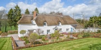 17th century thatched home for sale comes with its own "secluded" lake