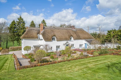 17th century thatched home for sale comes with its own "secluded" lake