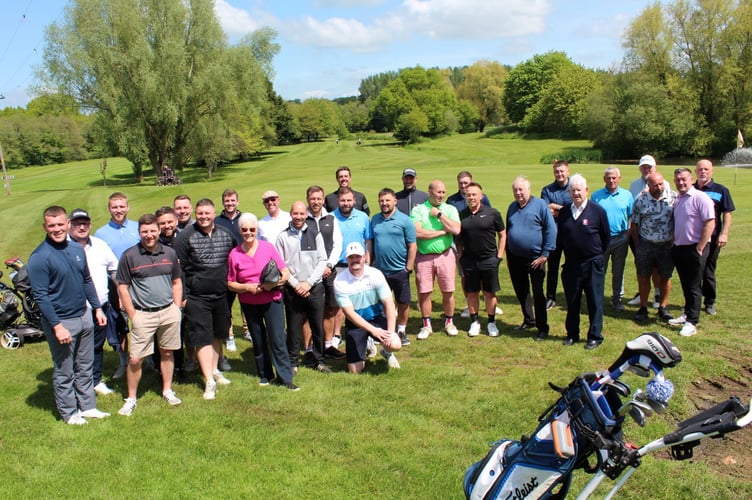 A group of golfers before setting off for the start.  Towards the right are Football Club chairman Bob Chamberlain and president Dave Blanchford, in pink Monica Blanchford.  SR 7729