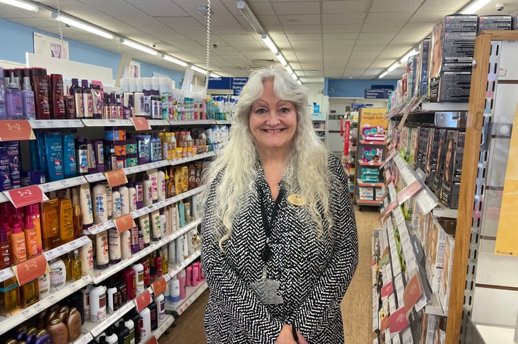 Wendy in one of the aisles in Boots in Crediton.  AQ 9679