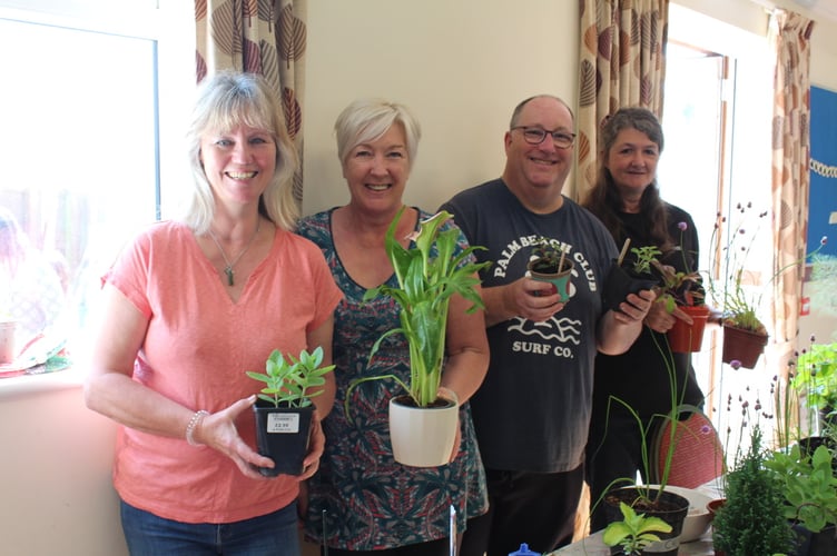 Cheriton Fitzpaine Garden Club members Susan Hewson, Gill Lomas with show secretary Jeaninne Rundle with chairman Andrew Dean.  SR 7792