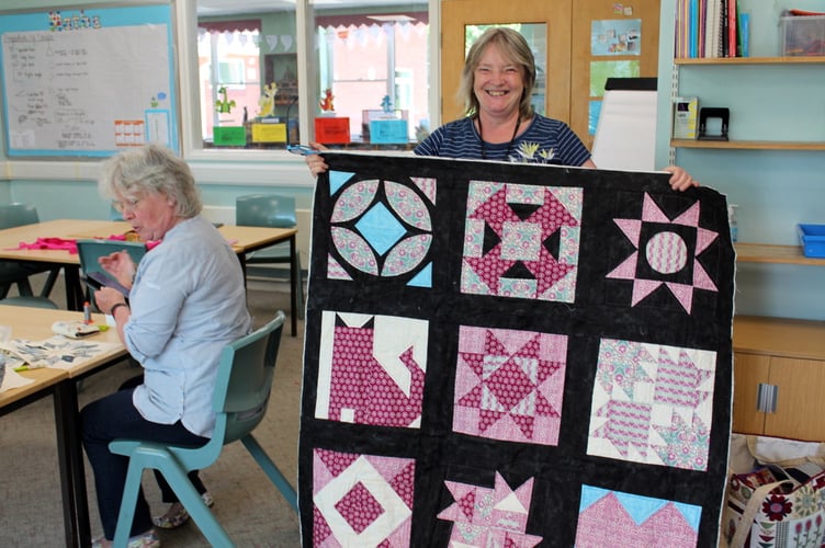 Sue Vile shows the lockdown quilt.  SR 7926