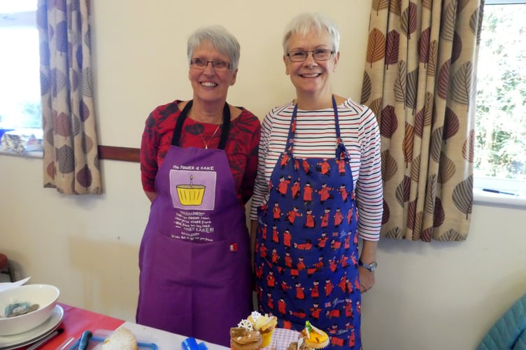 Lyn Porter and Andrea Enock behind the Cake Stall at Cheriton Fitzpaine Christmas Market.  David Nunn
