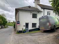 Driver reported after van crashes into house