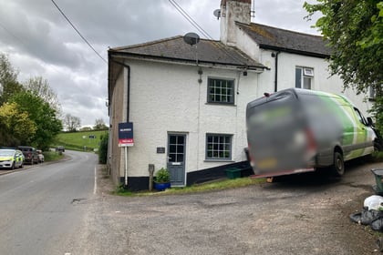 Driver reported after van crashes into house