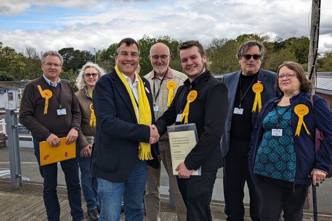 Lib Dem Teignbridge Leader and Newton Abbot parliamentary candidate Martin Wrigley welcomes new district councillor Jack Major. Central Devon parliamentary candidate Mark Wooding second from right 