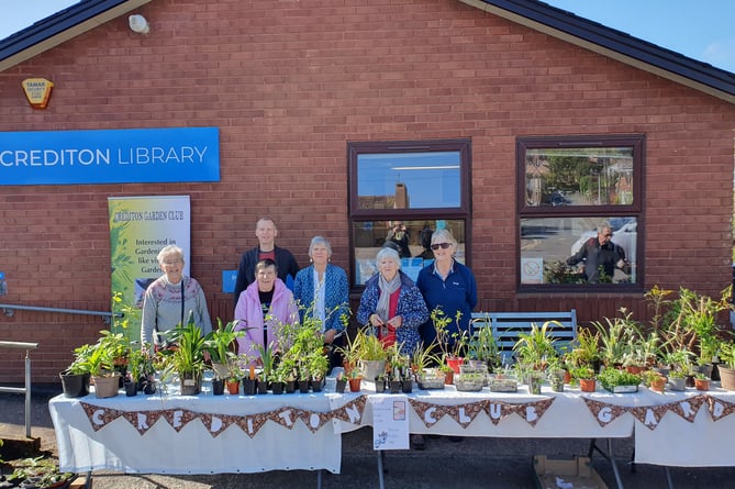 Helpers behind the plant stall at Crediton Library.
