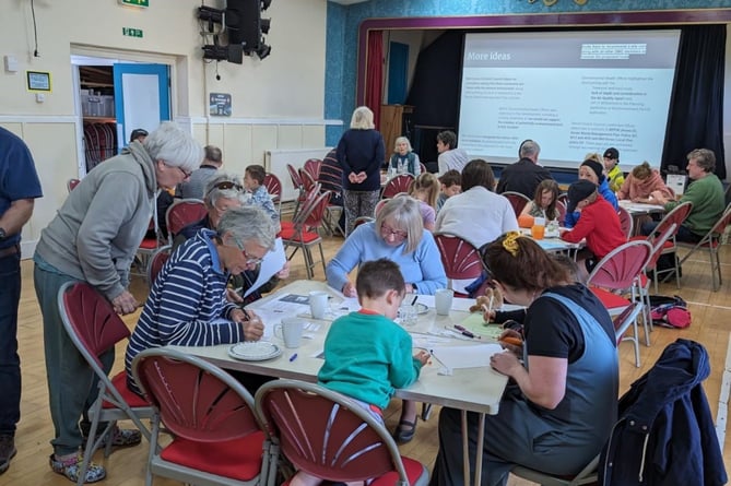 Writing objection letters in Sampford Peverell Village Hall