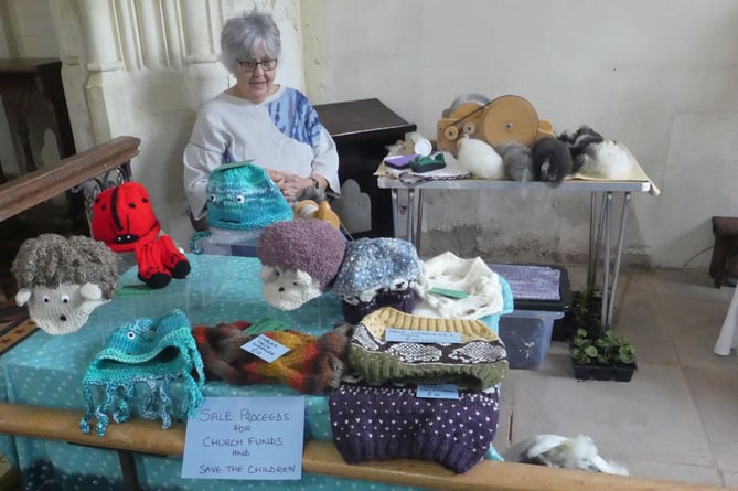 Marian Beresford demonstrating the art of spinning