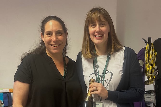 Foodbank Co-ordinator Helen Moores, right, thanks Melanie Gard of WSI Waverley Digital Marketing for her donation for the Tombola. 
