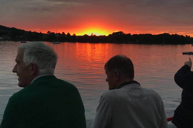 Rotarians enjoying the sunset on deck