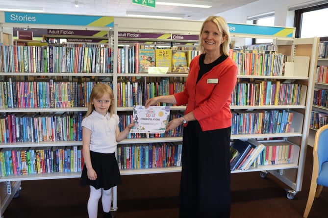 Eliza receiving certificate at Crediton Library