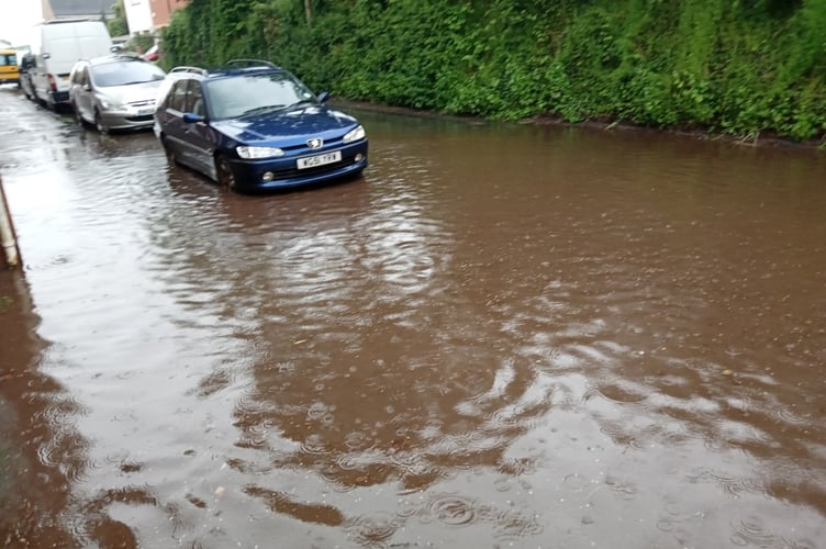 Parked cars along Landscore during the flood.
