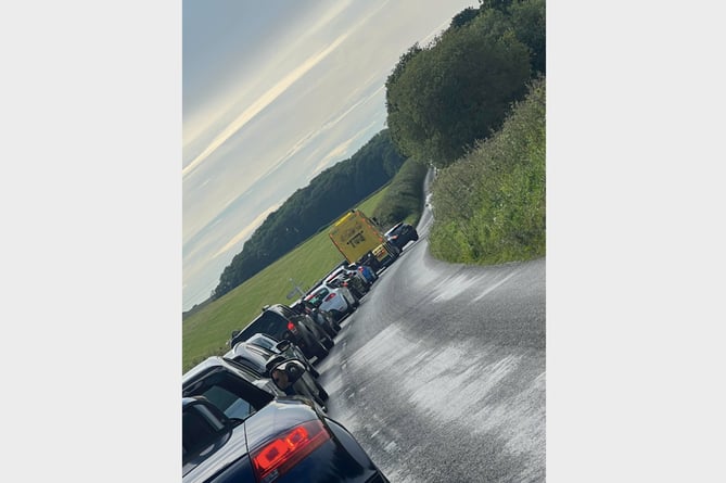 The traffic queue into Zeal Monachorum for Chulmleigh College School Prom on the B3220 this evening, Thursday, June 20.
