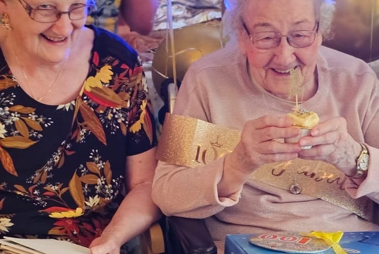 Audrey Coulstock, right, on her 100th birthday.
