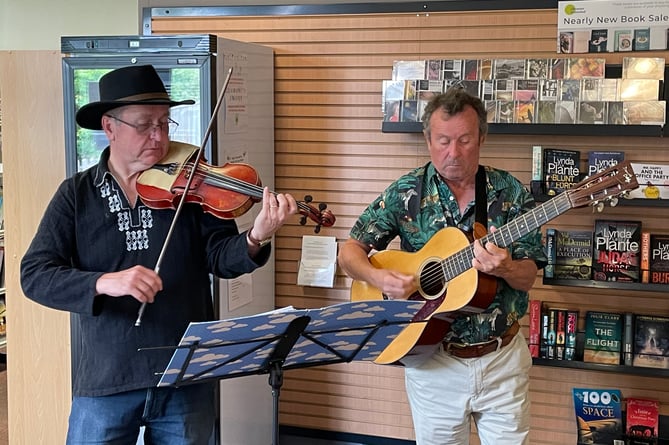 Talented musicians busking in Crediton Library.  AQ 5623
