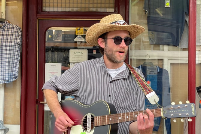 Busking outside A E Lee (Outfitters) Ltd as part of Busk It!  AQ 5617
