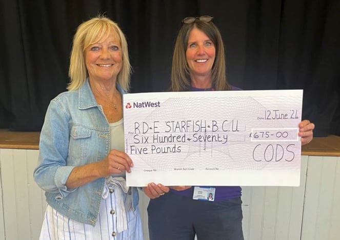 Carol Stoyle from CODS presenting the cheque to Debbie Allen of the RD and E Charities.
