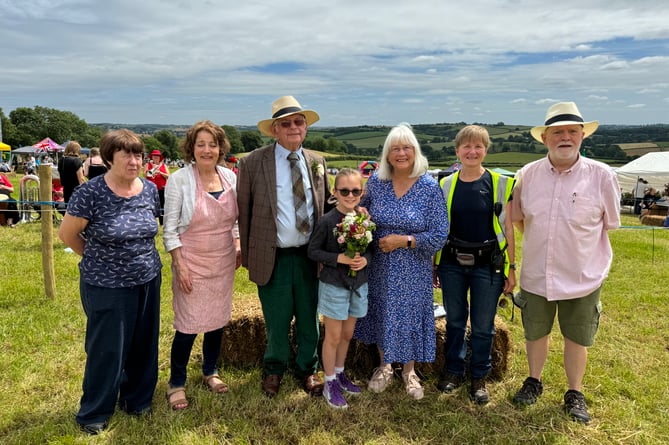 John and Jo Dyke, centre, guests who opened the Fete with some of the Fete Committee and chairman, Ivan Kriznik, right.  AQ 6214
