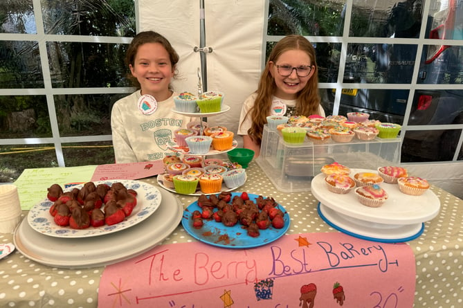 Two youngsters sold cakes and other treats they had made.  AQ 6964