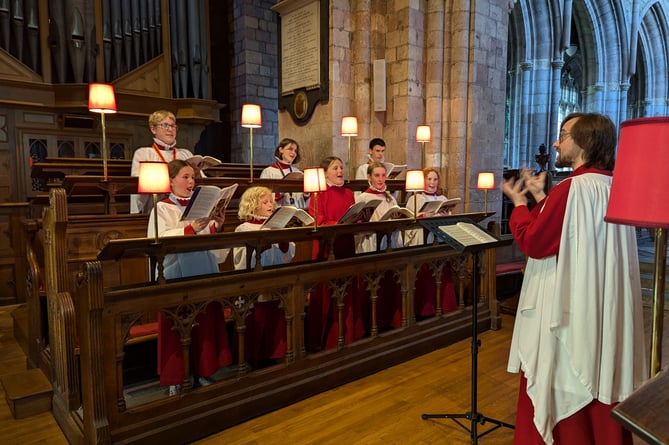 Some of the members of Crediton Parish Church junior choir and Jon Rawles.