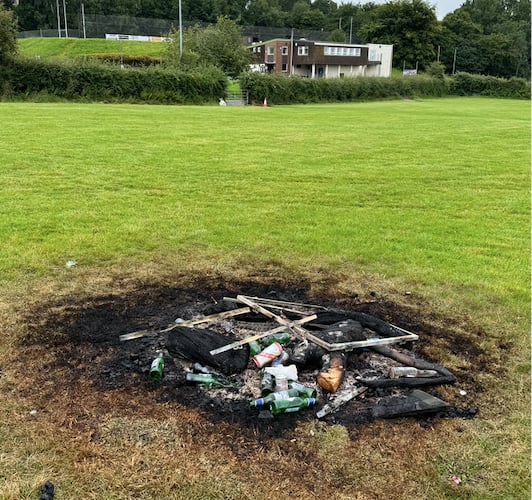 Bottles and other items in the bonfire on the rugby pitch.  AQ 8037