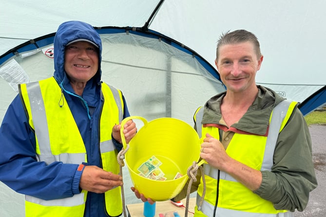 Collecting donations at the entrance to the Family Fun Day.  AQ 7844