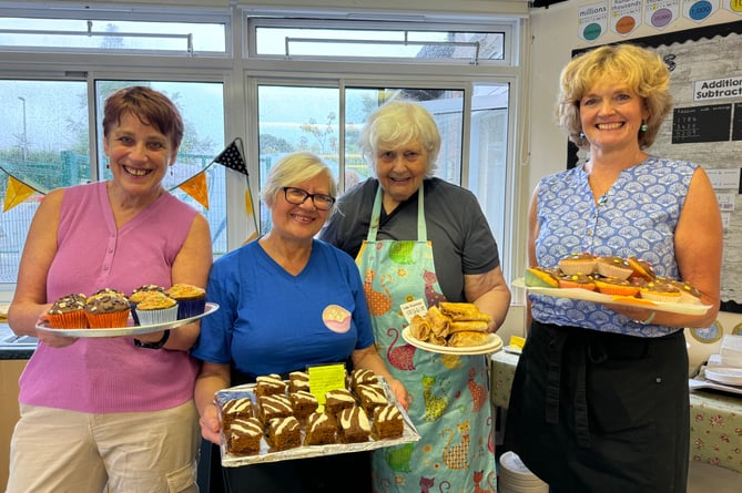 The cake stall was very busy.  AQ 7849
