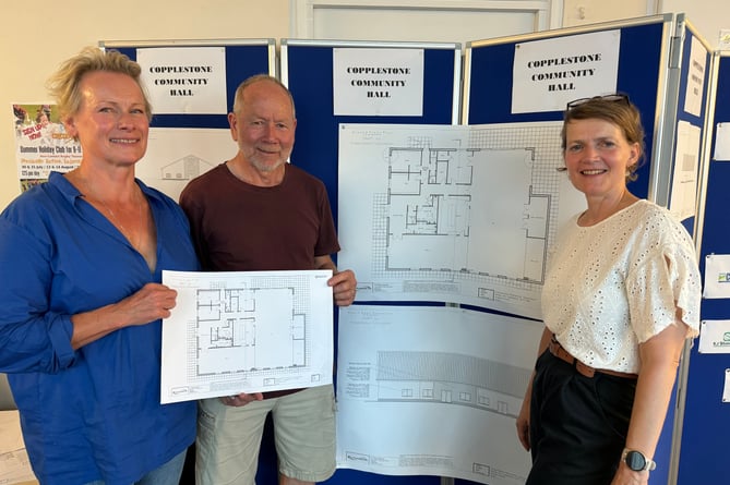 From left, Stef Uter and Dave Brassington, directors of Copplestone Recreation Association with the display of plans for Copplestone Community Hall with Alison Coffey from XL Planning, which is involved in the hall project.  AQ 7903
